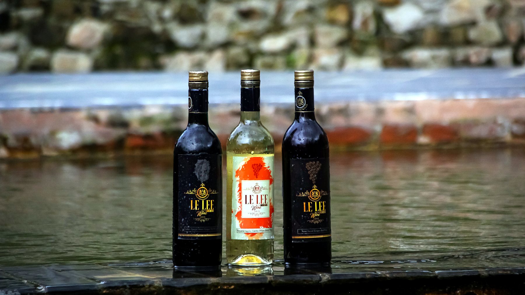 The three Le Lee wines standing at the edge of the stream in Le Le